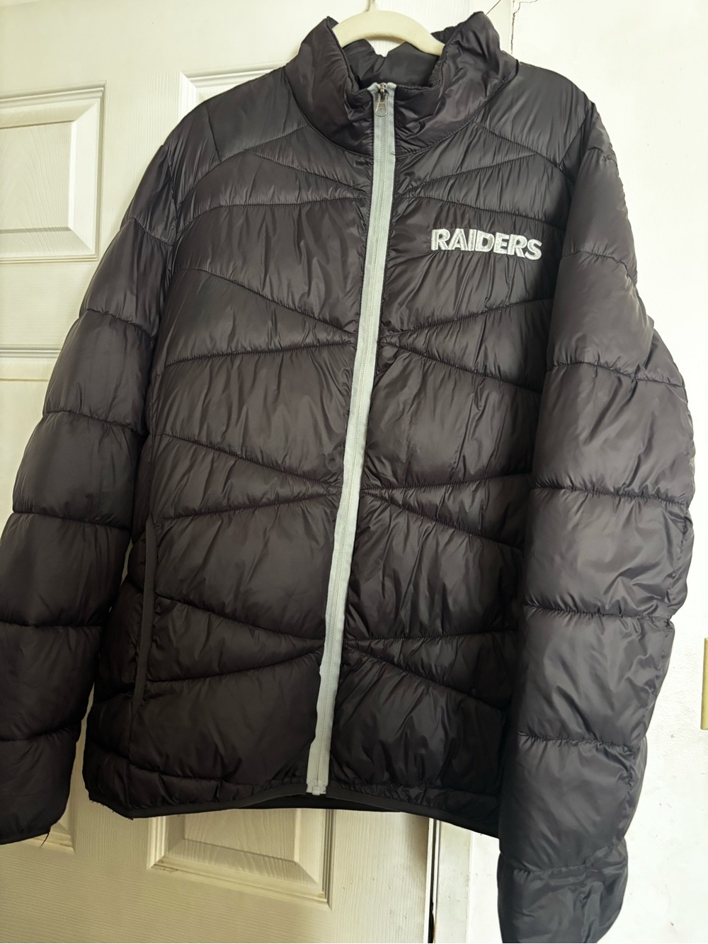 NFL Raiders Black Quilted Puffer Jacket with Gray Zipper